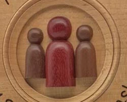 Relief elements added to a turned wooden trophy