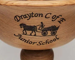 pyrographed dedication on a trophy base